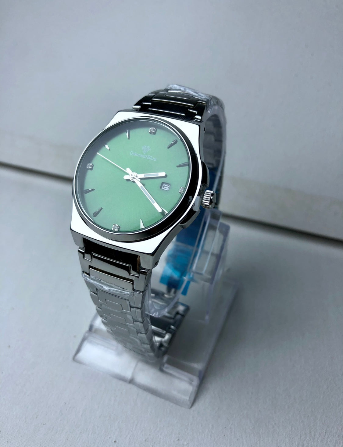 Diamond blue green dial